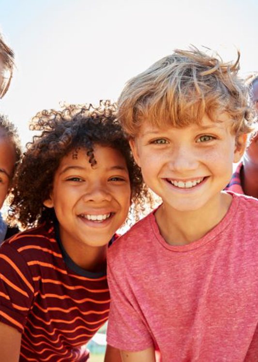 Happy, smiling group of preteen friends