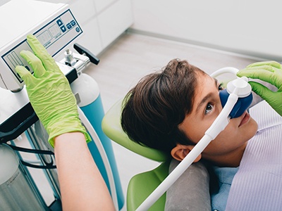 Young boy wearing nasal mask for nitrous oxide