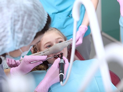 Young girl undergoing dental treatment with nitrous oxide