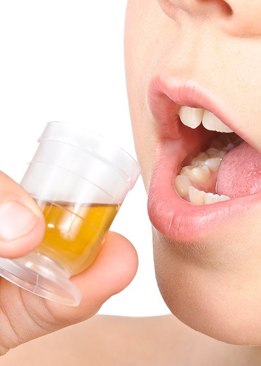 Child preparing to drink liquid medication